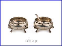A Pair Of Antique Georgian Style Sterling Silver Footed Salts & Spoons