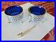 A-lot-of-2-Antique-Gorham-Sterling-Silver-and-Blue-Glass-Salt-Cellars-a-Spoon-01-zak