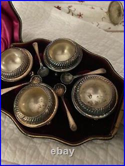 Antique sterling silver salt cellars with spoons (set of 4) in original box