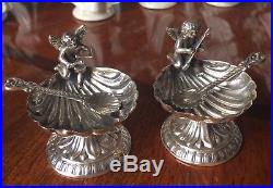 Pair of sterling silver cherub musicians on shells master salt cellars + spoons
